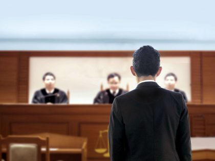 Court attorney lawyer talking to magistrate in courtroom